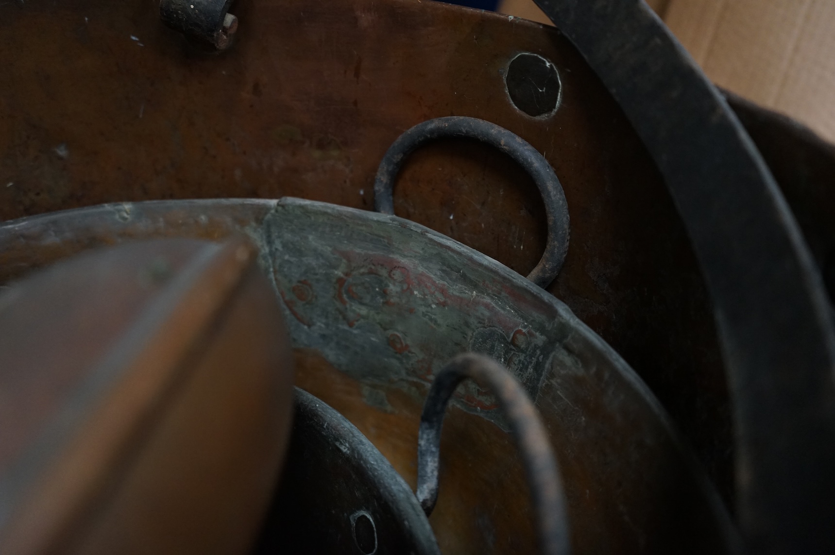 Four copper pans and a copper warming vessel